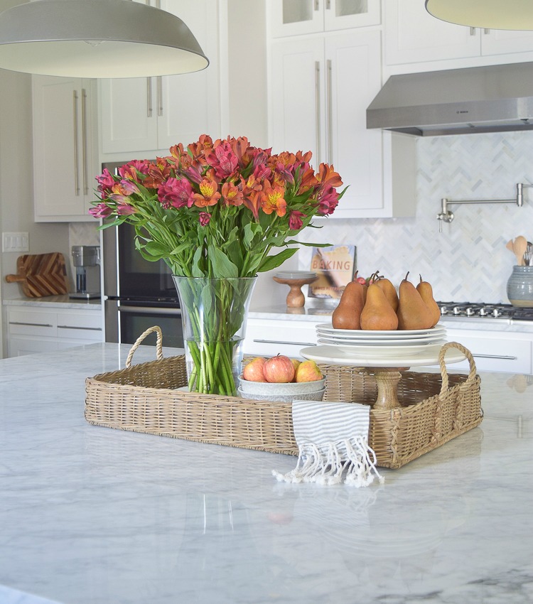 Kitchen Island with Metal Tray of Flowers, Containers and Bowls