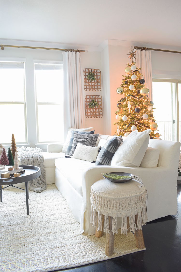 Black, white & gold modern Christmas living room tour - white sofa with Christmas themed pillows