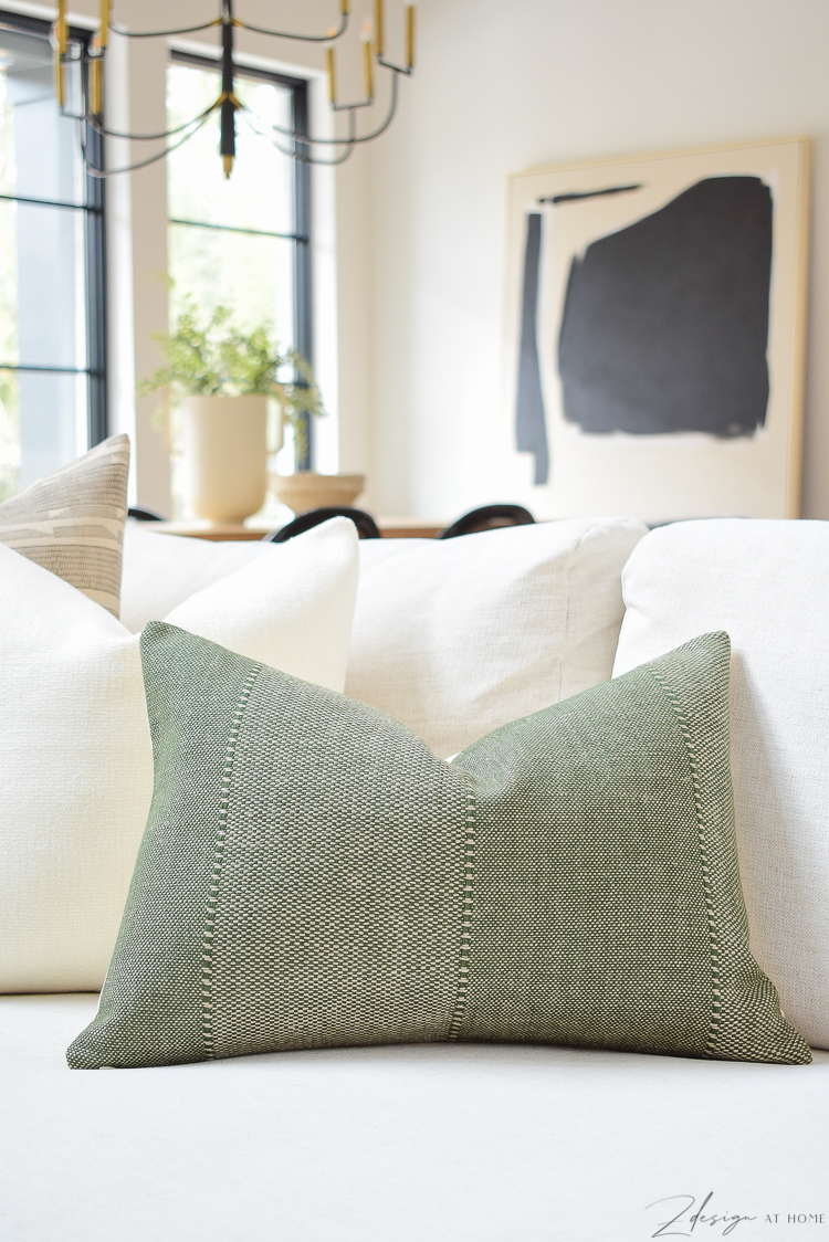 https://www.zdesignathome.com/wp-content/uploads/2021/02/spring-pillow-refresh-tips-best-inserts-caravane-pillow-cover-delta-olive-green-texture-white-chunky-linen-sevilla-designer-pillow-brown-boho-pattern-2.jpg