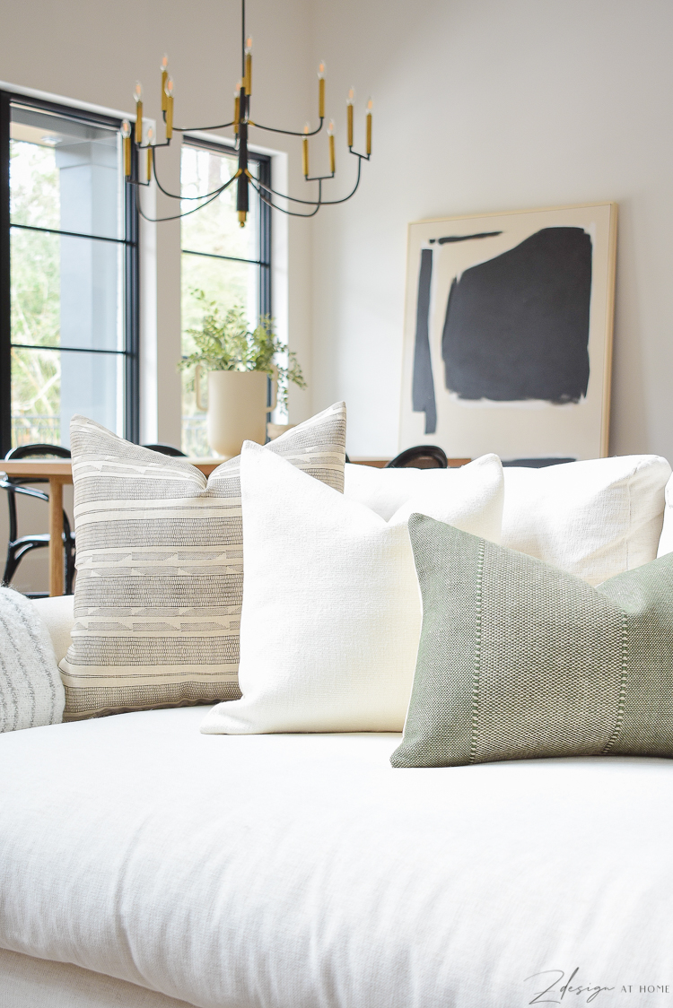https://www.zdesignathome.com/wp-content/uploads/2021/02/spring-pillow-refresh-tips-best-inserts-caravane-pillow-cover-delta-olive-green-texture-white-chunky-linen-sevilla-designer-pillow-brown-boho-pattern-6.jpg