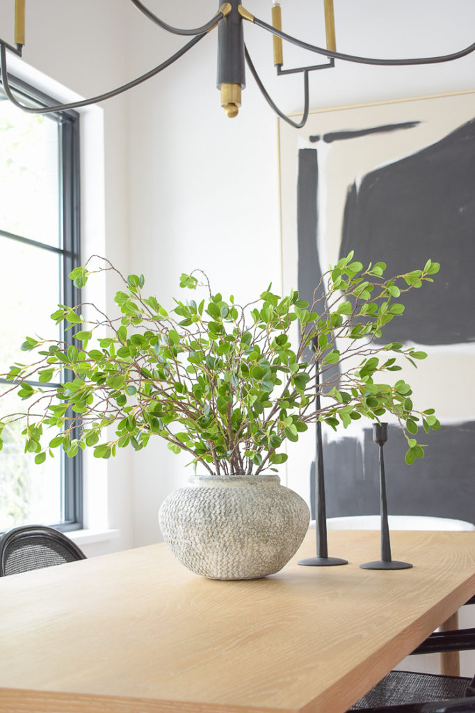 textured gray vase with amazon stems