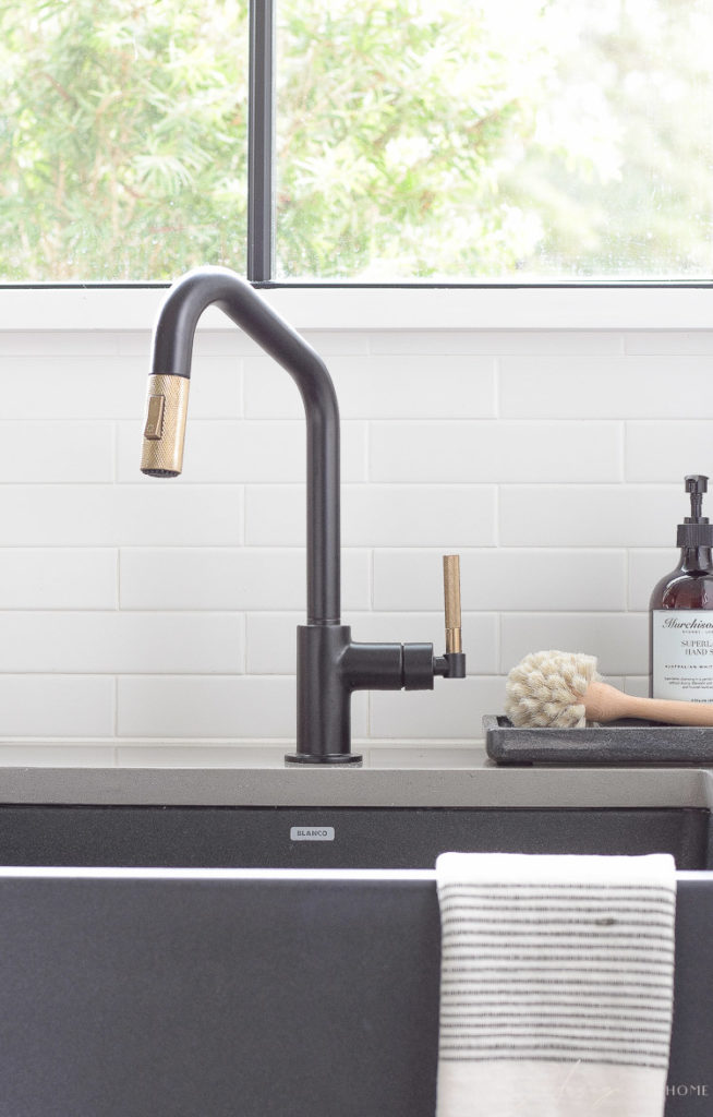 brizo little faucet in black and luxe gold