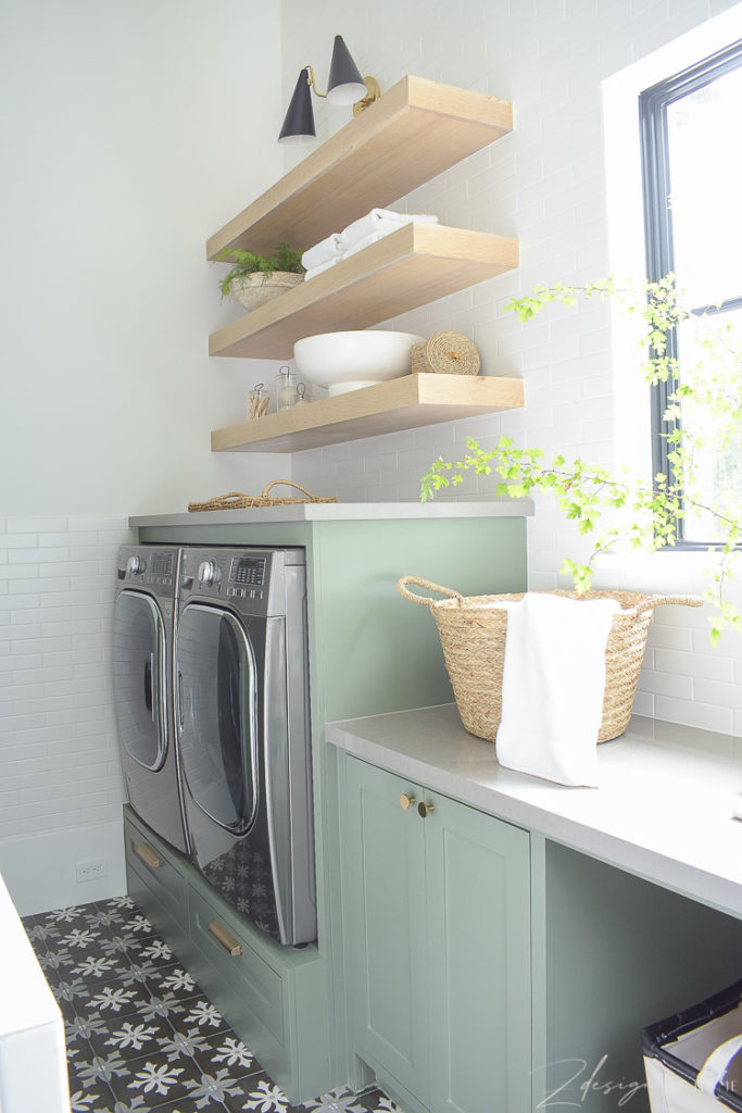 builtin washer and dryer with white oak shelves above