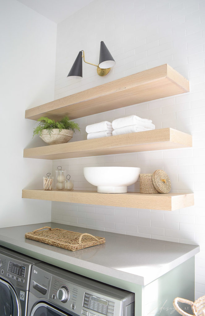 white oak laundry room shelves styled to perfection