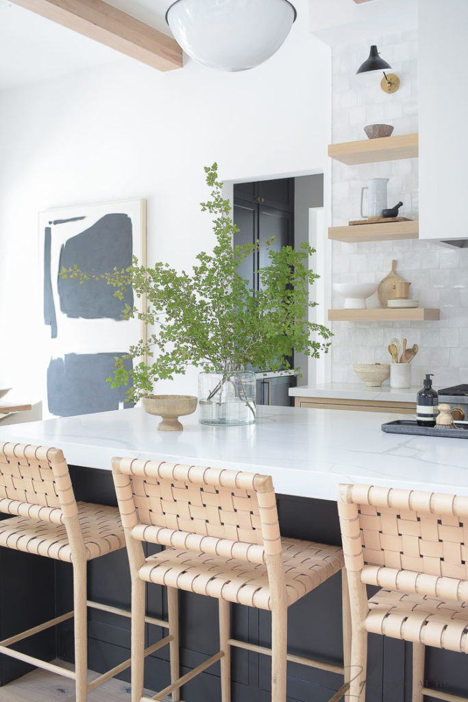 modern farmhouse kitchen with 3 cabinet colors - white oak, sw snowbound and black island