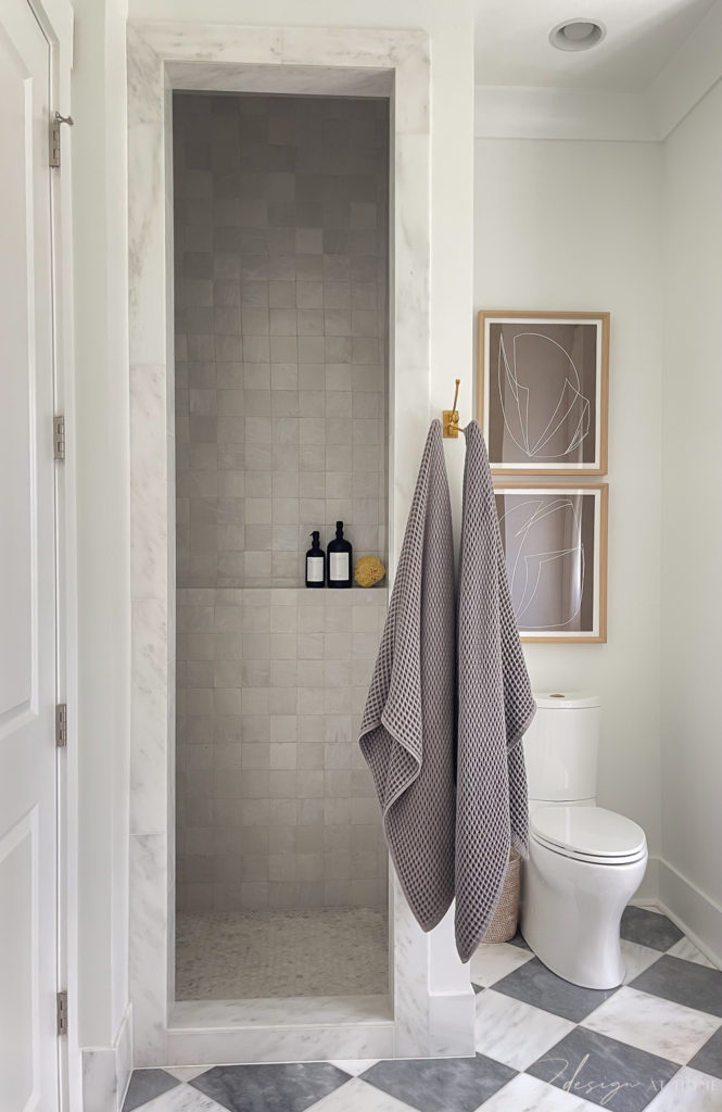 primary master bath with harlequin marble pattern tile and zellige shower tile