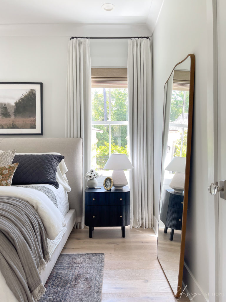 white linen curtains layered neutral bed