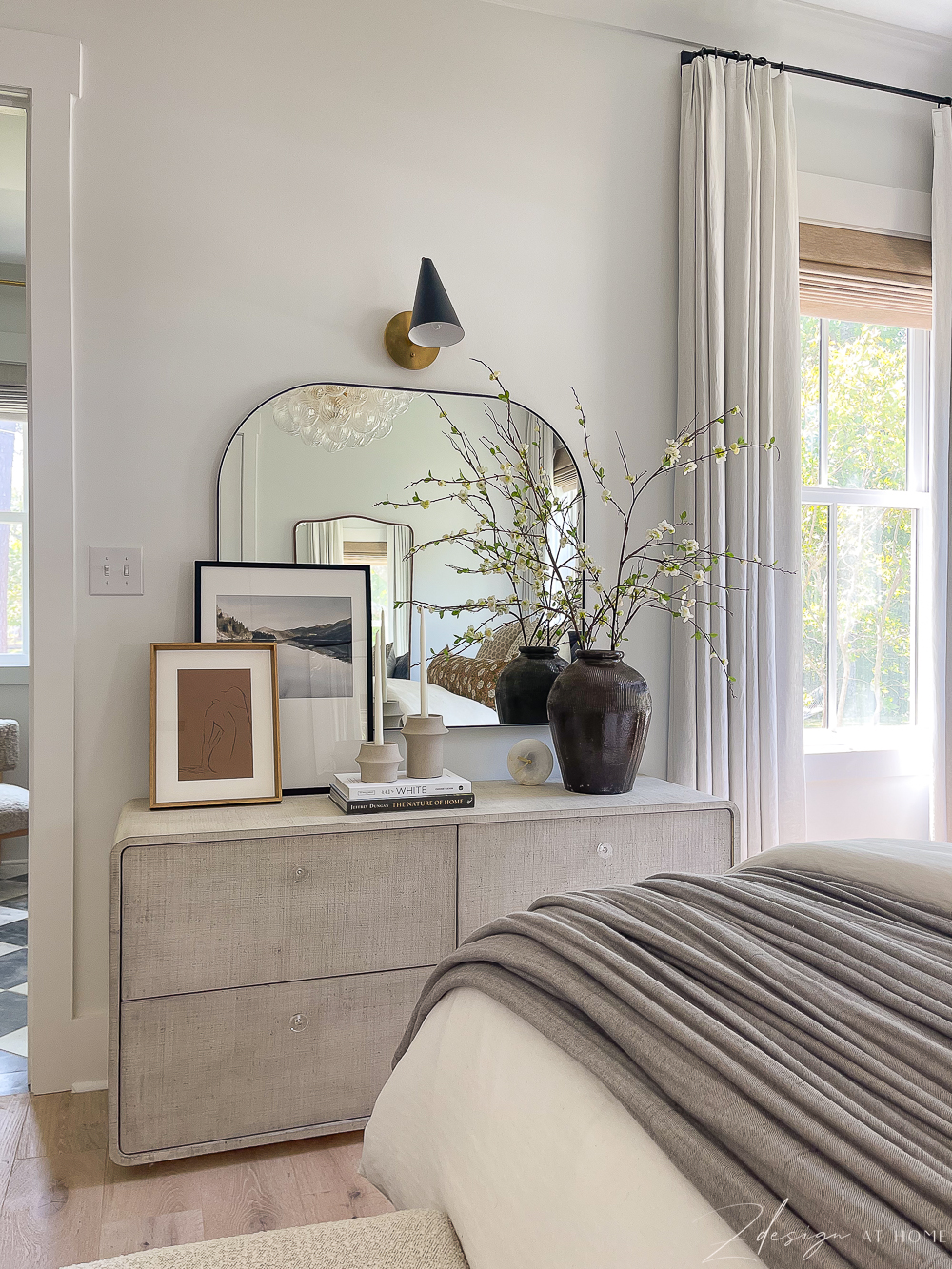 styled bedroom dresser with arched mirror and sconce over mirror, white linen custom curtains 