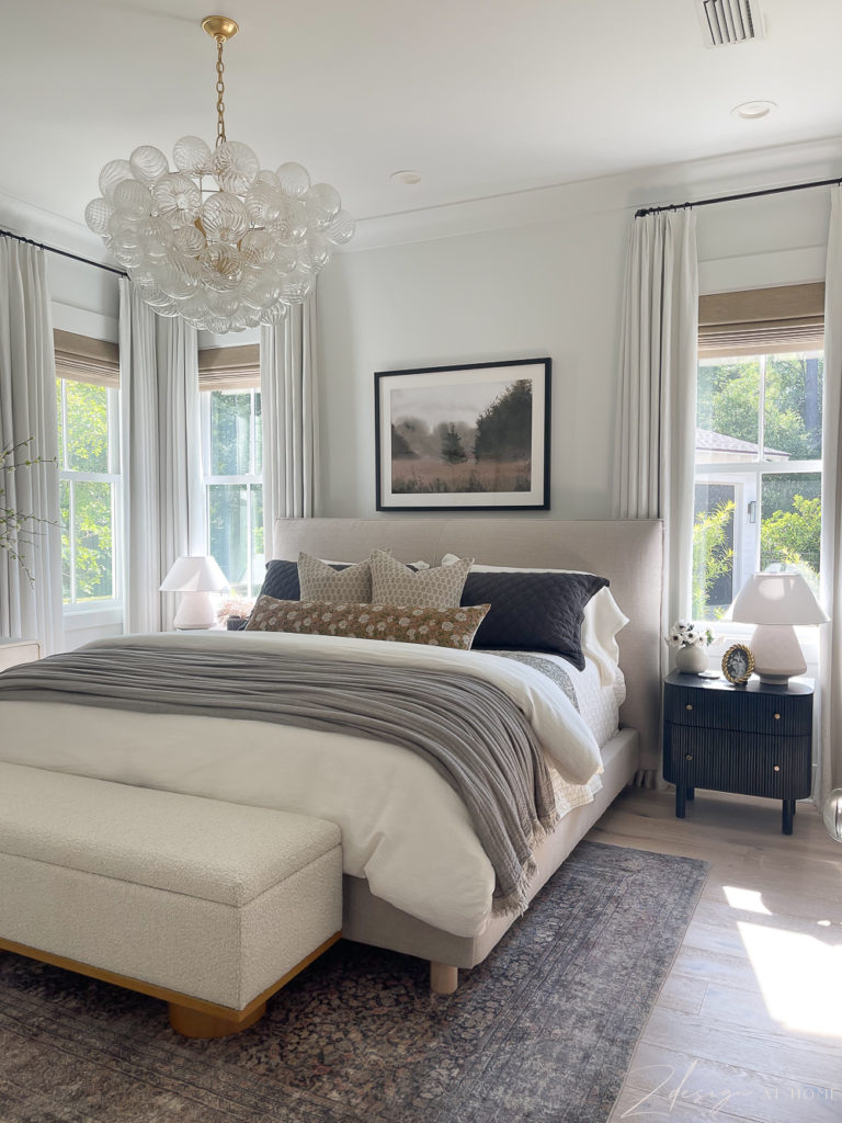 lux neutral bedroom with linen layers and talia chandelier morgan denim rug