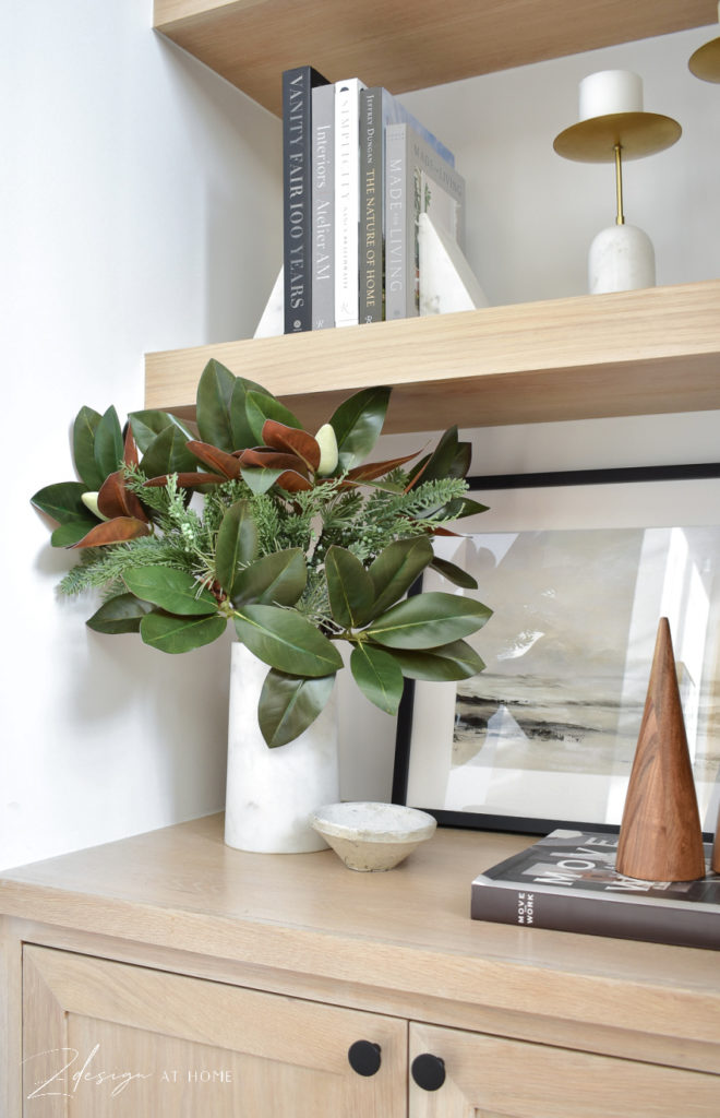 magnolia stems in a marble vase for the christmas and the holidays 